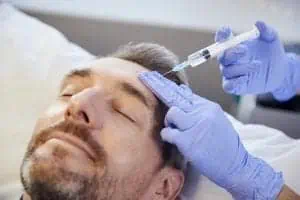 Man gets Botox injection in forehead