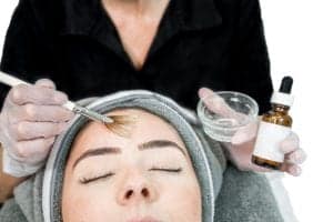 Woman undergoing chemical peel