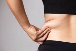 Woman pinching waist fat