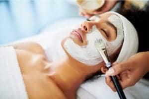 young woman during facial treatment at Water's Edge Dermatology