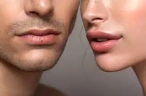 Closeup of a beautiful man and woman with a focus on the lips free of cold sores