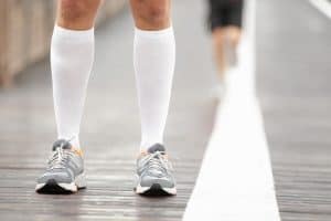 Man wearing compression socks for running