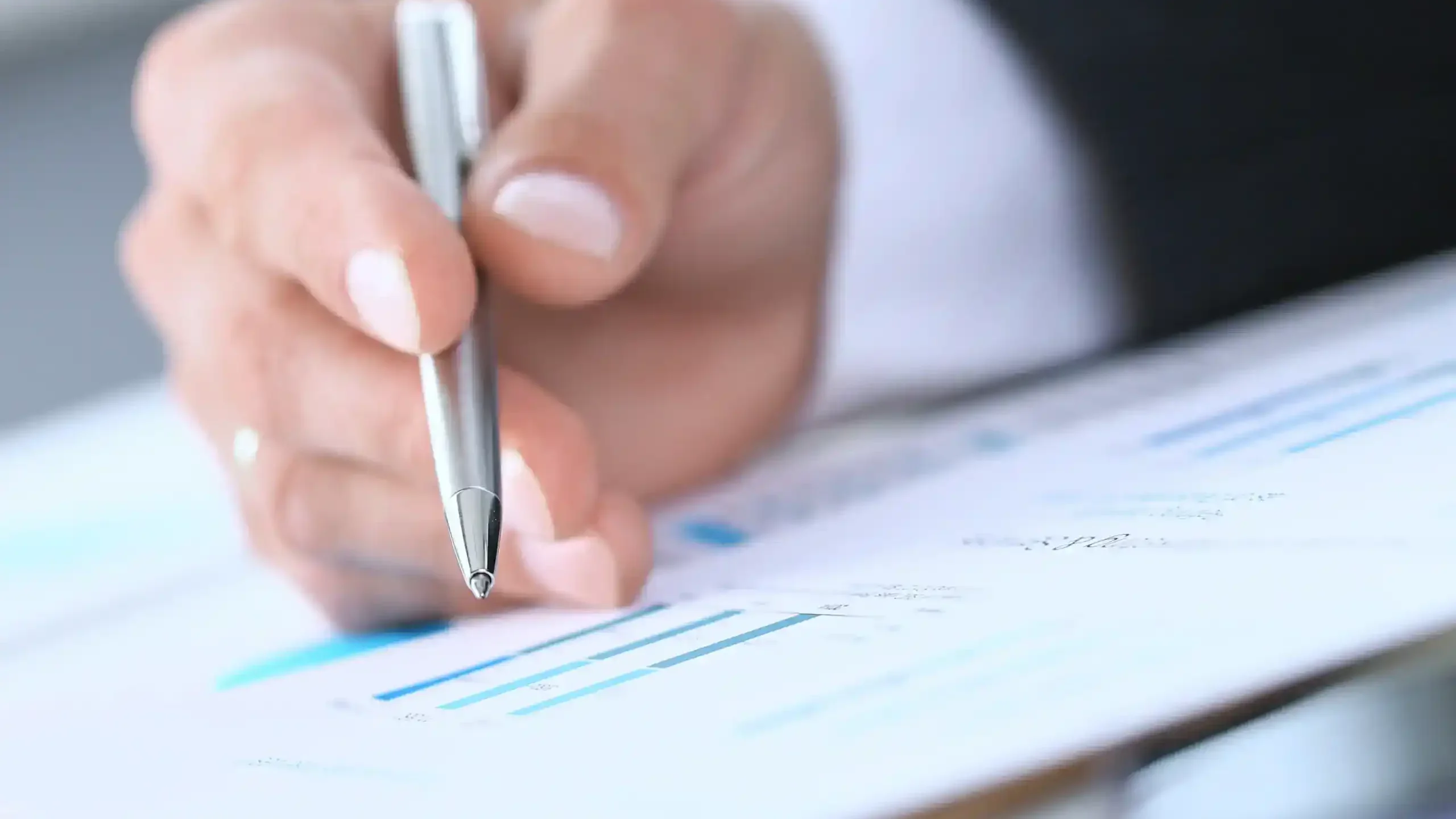 man filling out financial paperwork
