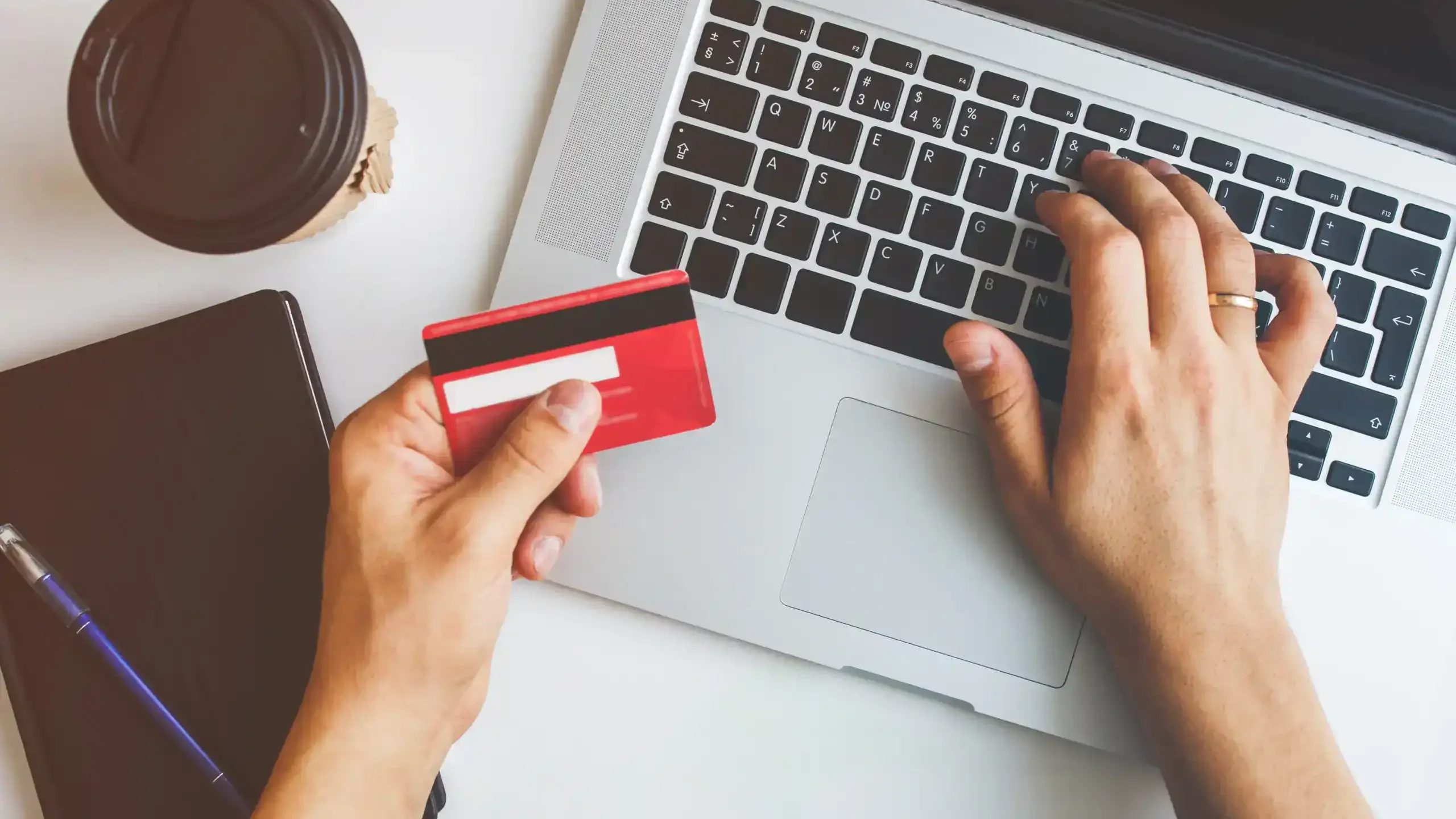 man using credit card to pay bill online
