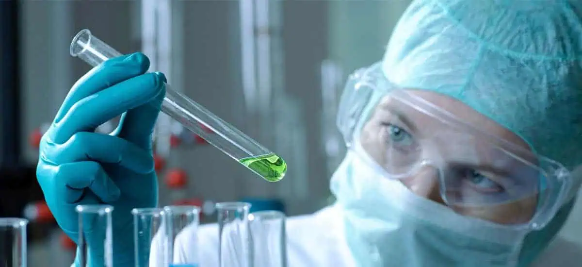 Lab technician examining a test tube
