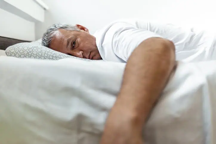 Man sleeping on a mattress