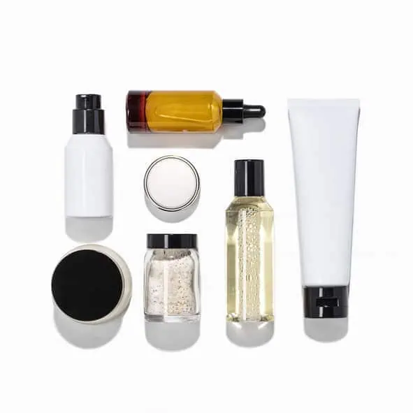 Skin care products arranged neatly on white surface