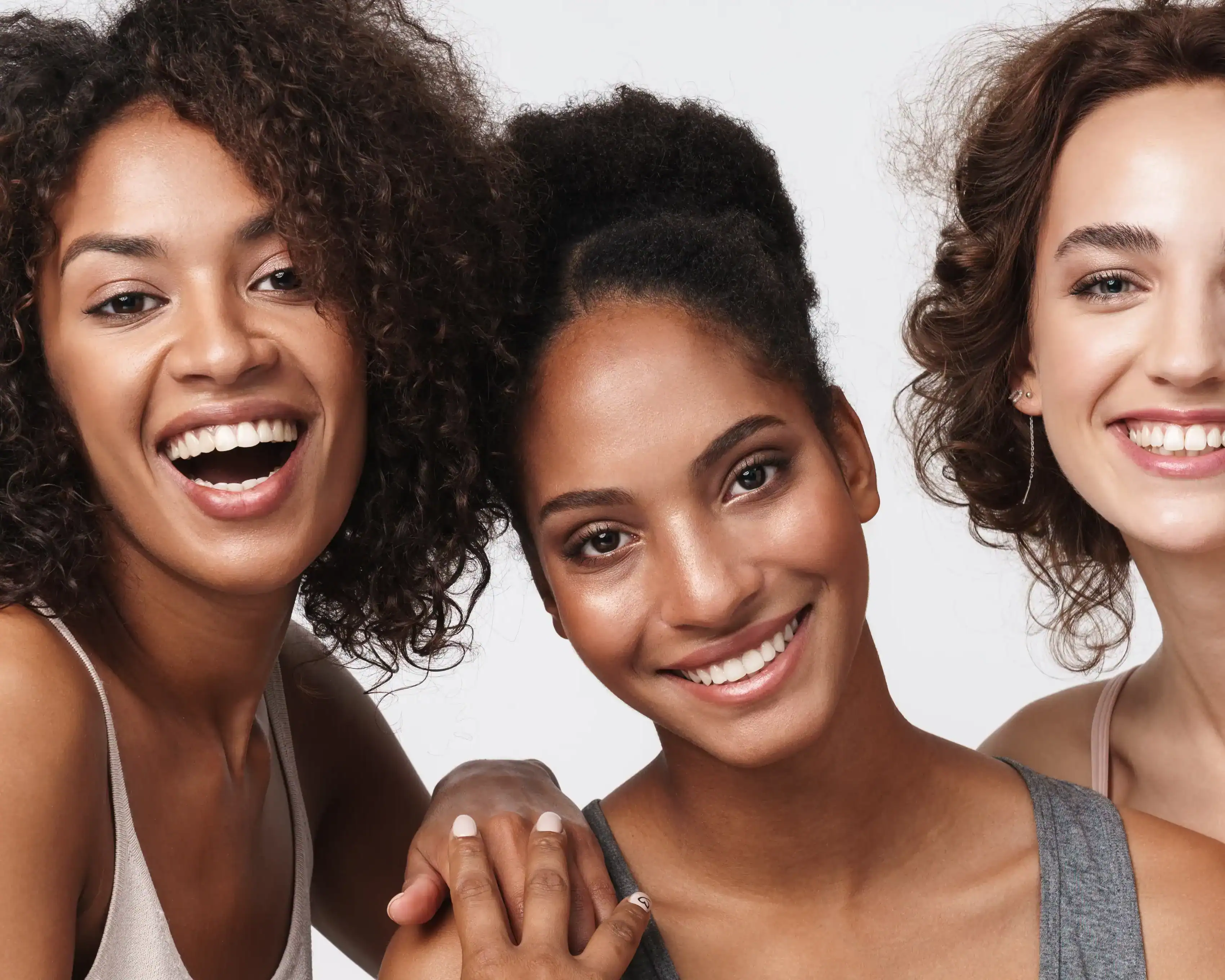 Three beautiful women with different skin needs